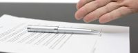 Businessman offering to sign a contract size for slide